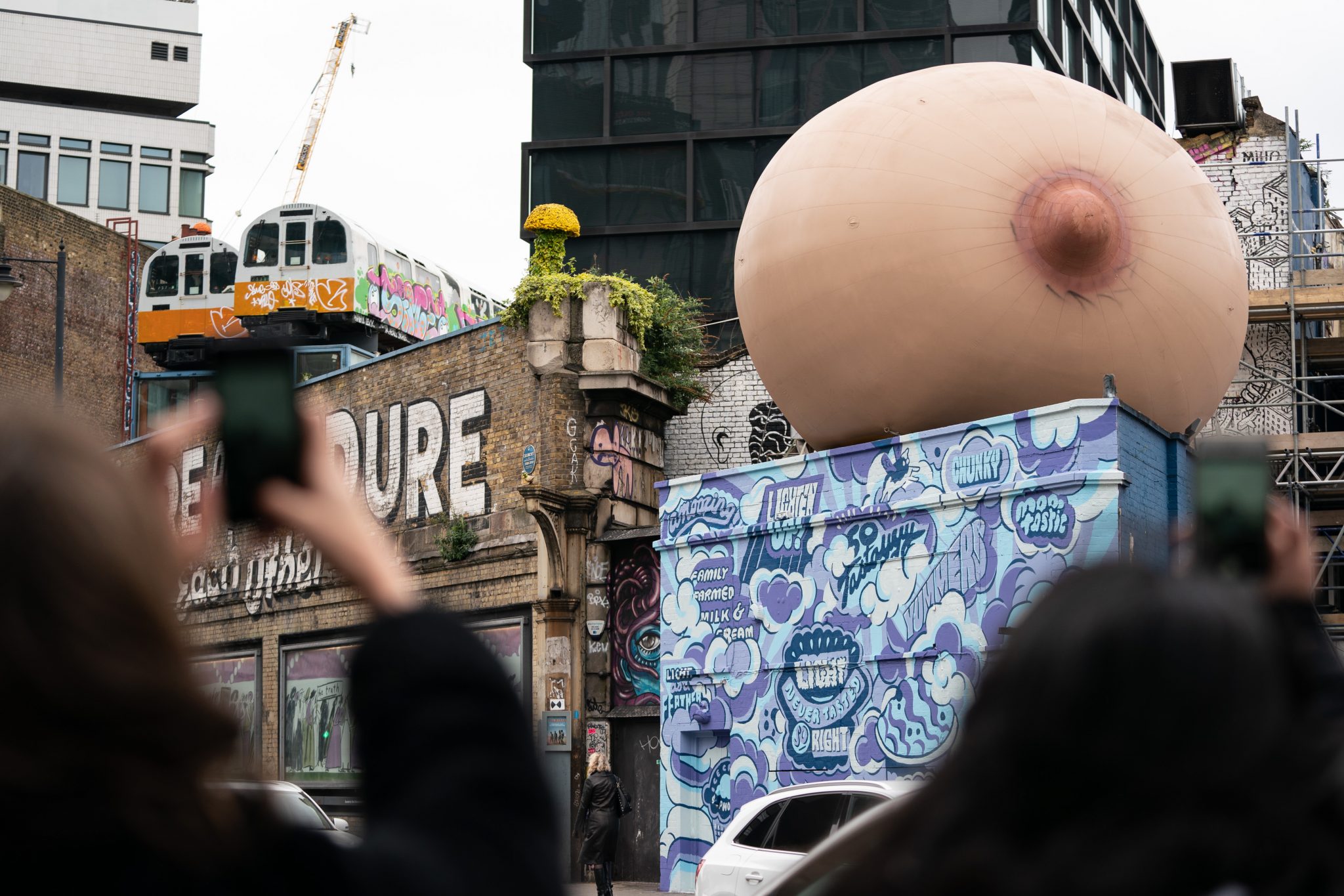 Photo of a giant breast on top of a roof in Shoreditch, which was part of a marketing stunt by femtech startup Elvie.