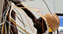 man fixing electric cables