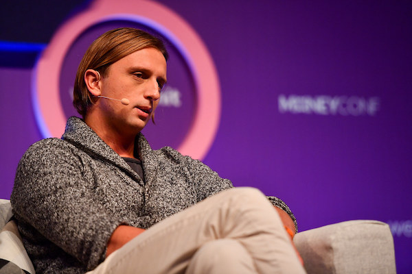 Photo of Revolut founder Nik Storonsky on stage at a conference