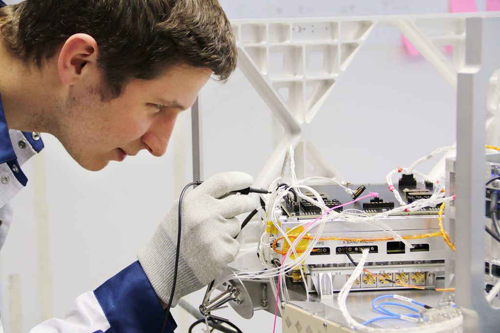 A picture of Rafal Modrzewski, cofounder and CEO of ICEYE, working in a lab.