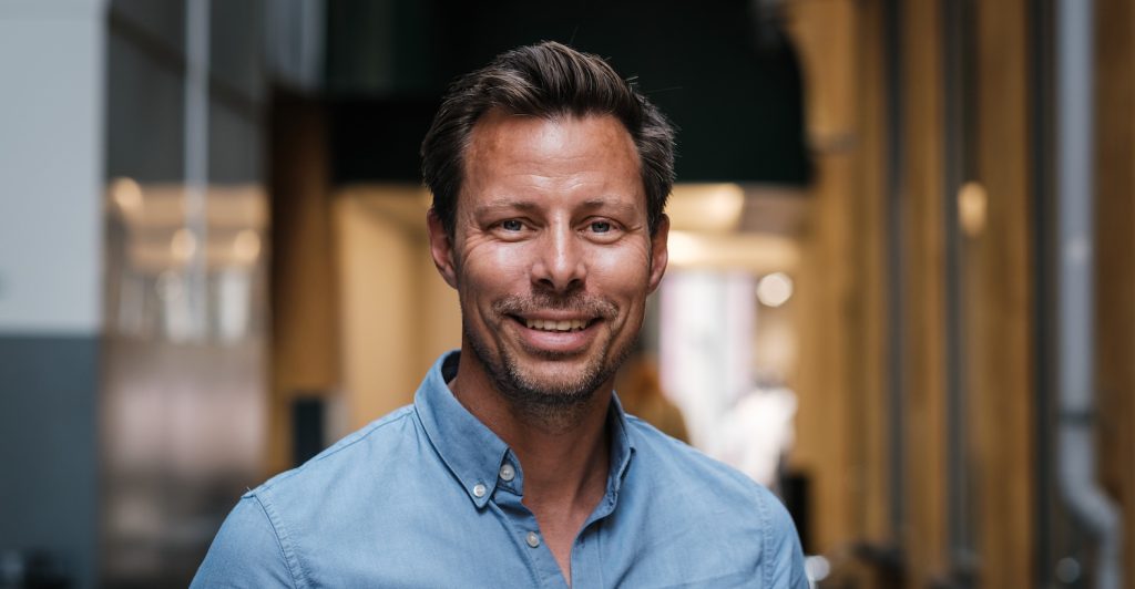 A headshot of Dixa cofounder Mads Fosselius, who explains the secret to startup M&A strategy