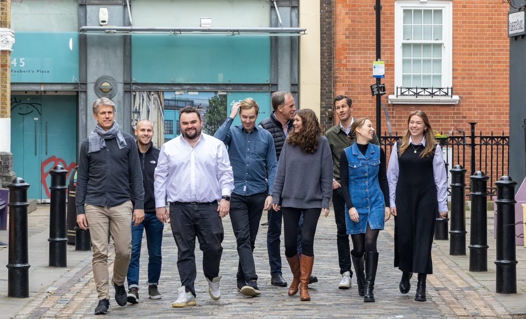 An image of the Creandum team walking together down a street