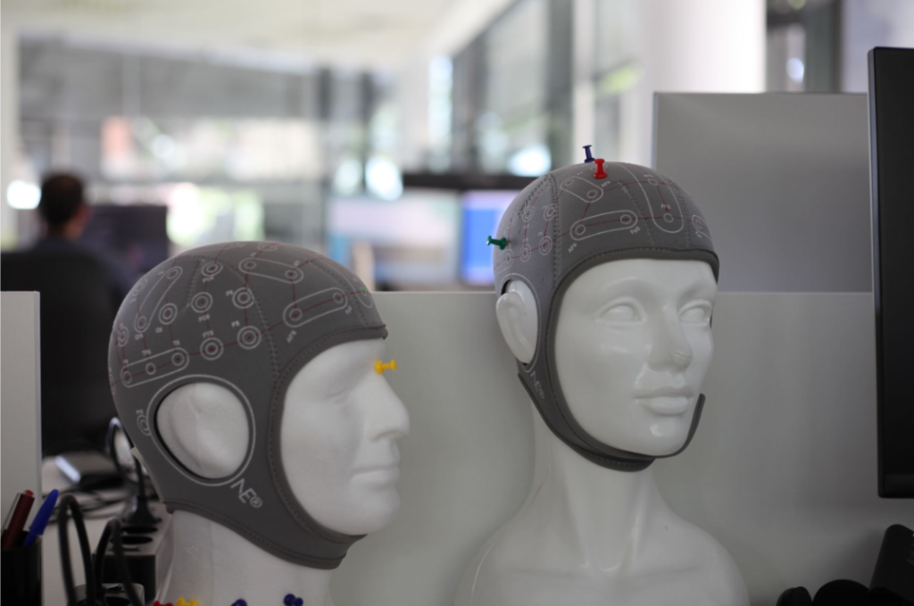 An image of two mannequin's wearing Starstim headcaps