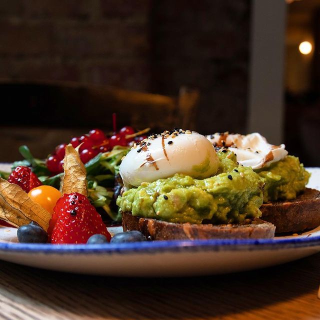 A picture of eggs and avocado on toast.