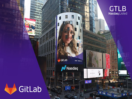 A picture of an electronic billboard with a GitLab ad on
