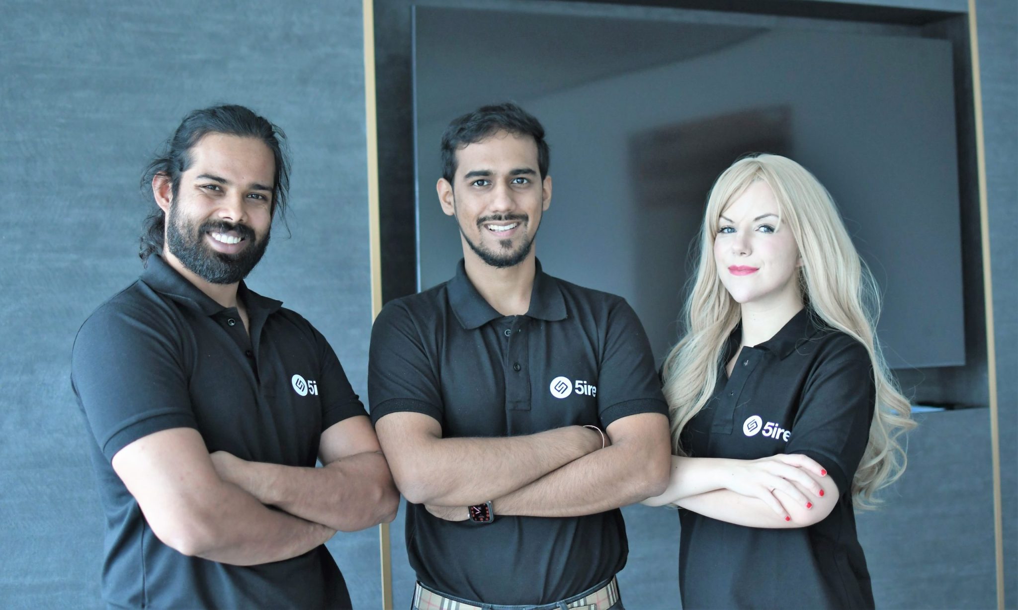 A landscape image of the 5ire team, wearing branded polo shirts.