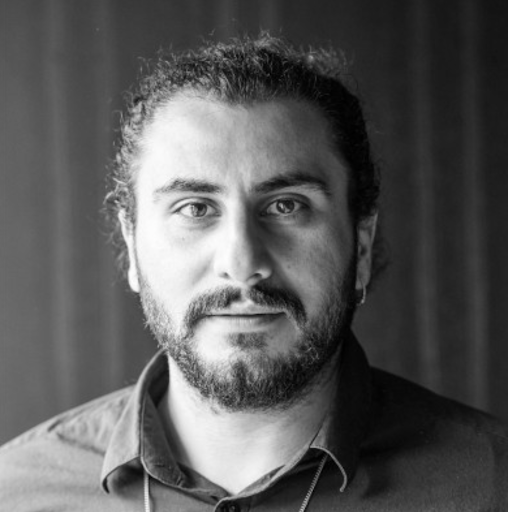 A black and white headshot of Ozan Polat, partner at Vine Ventures.